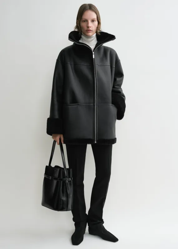Signature shearling jacket black sold by Toteme