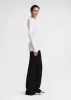 Slim chenille knit white sold by Toteme