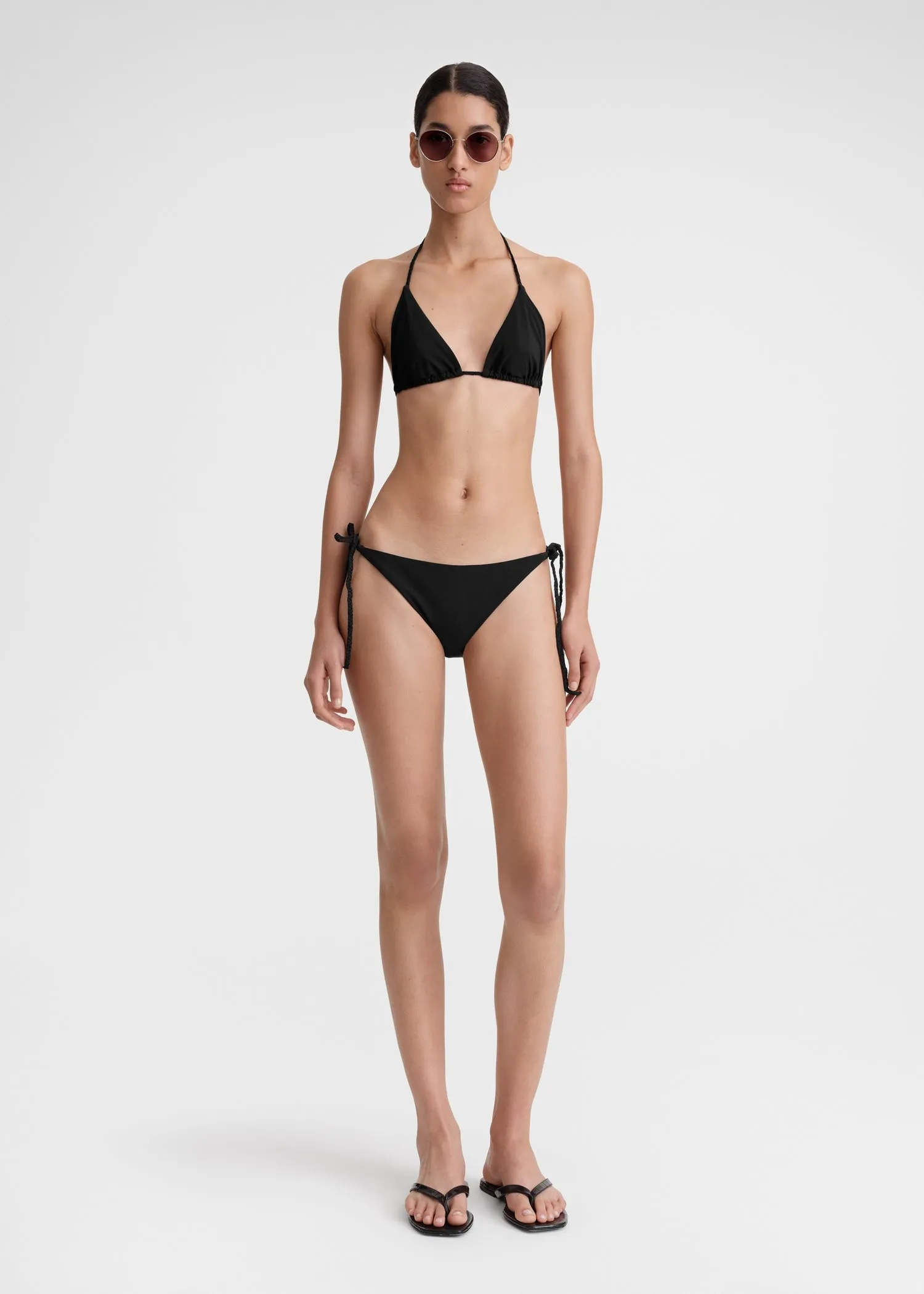 Braid-tie bikini bottoms black sold by Toteme