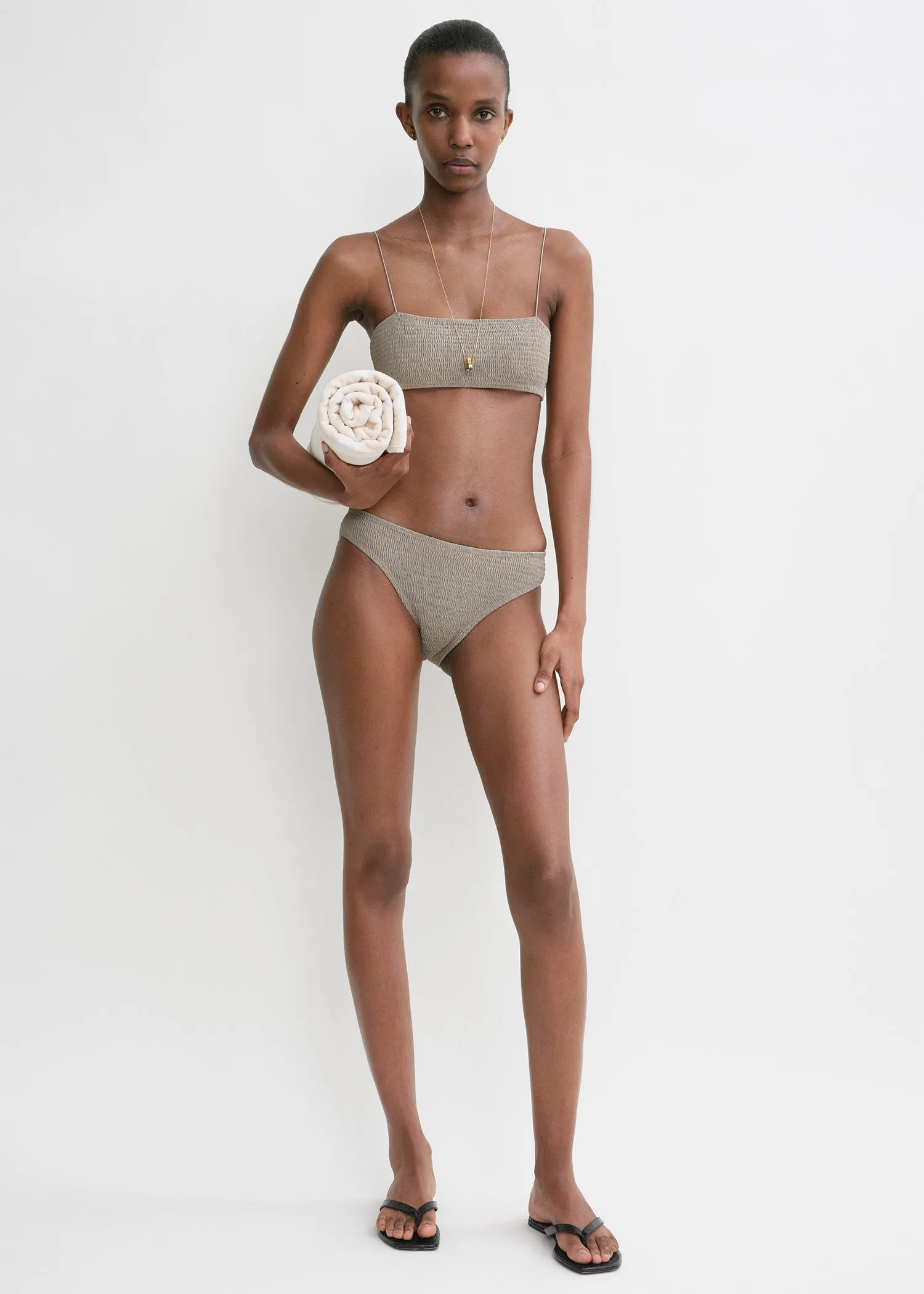 Smocked bikini top dove sold by Toteme