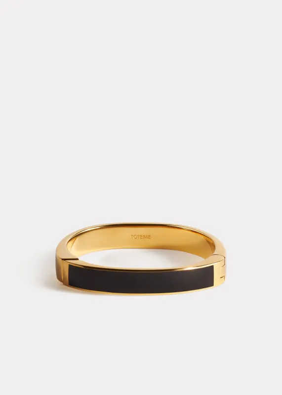 Signature bracelet black/gold sold by Toteme