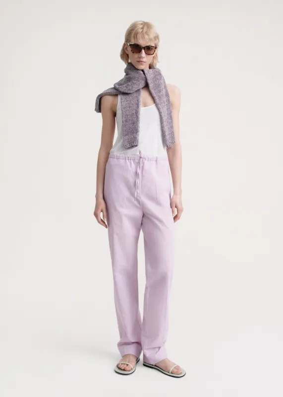 Press-creased drawstring trousers lilac sold by Toteme