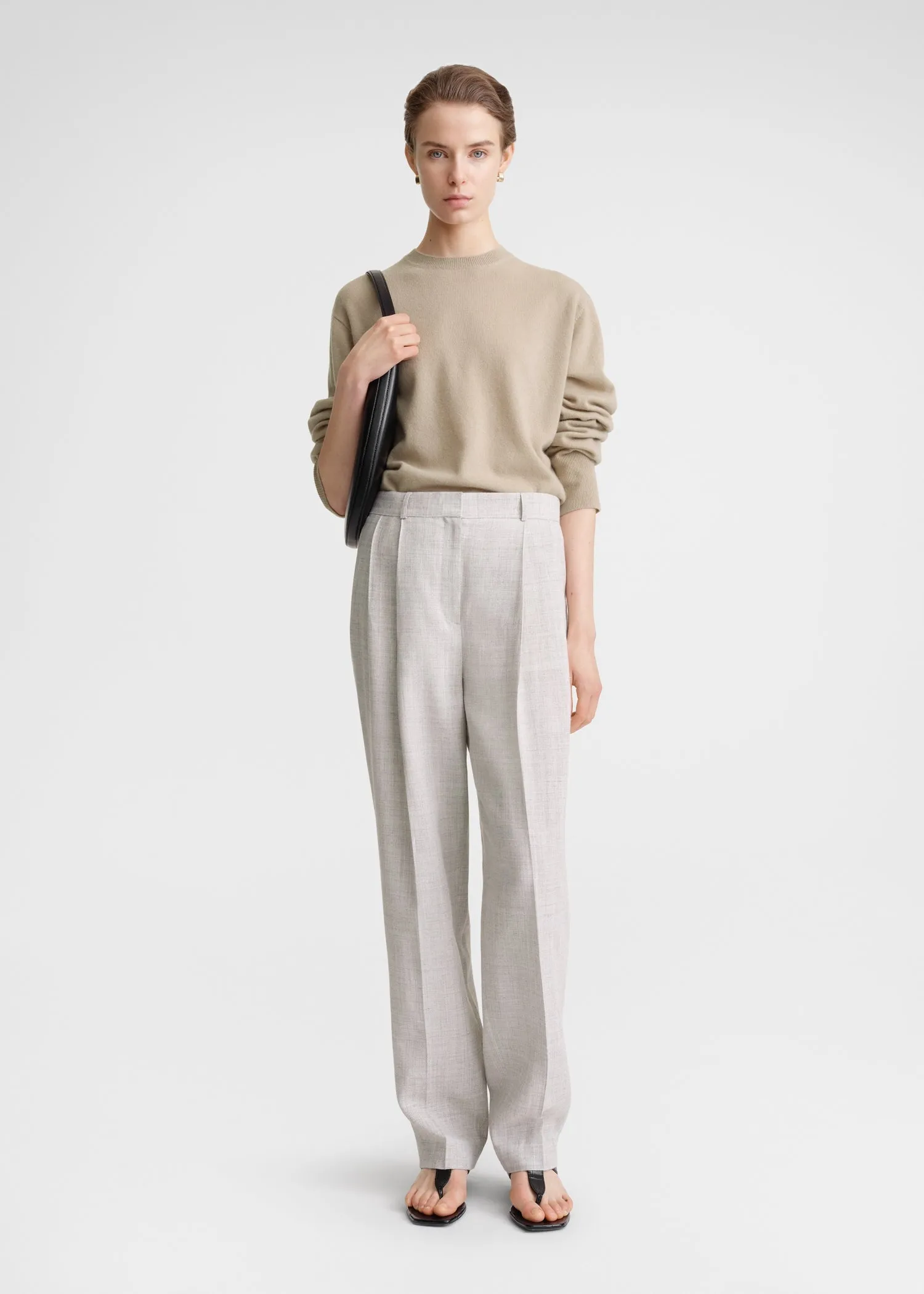 Double-pleated tailored trousers oat melange sold by Toteme