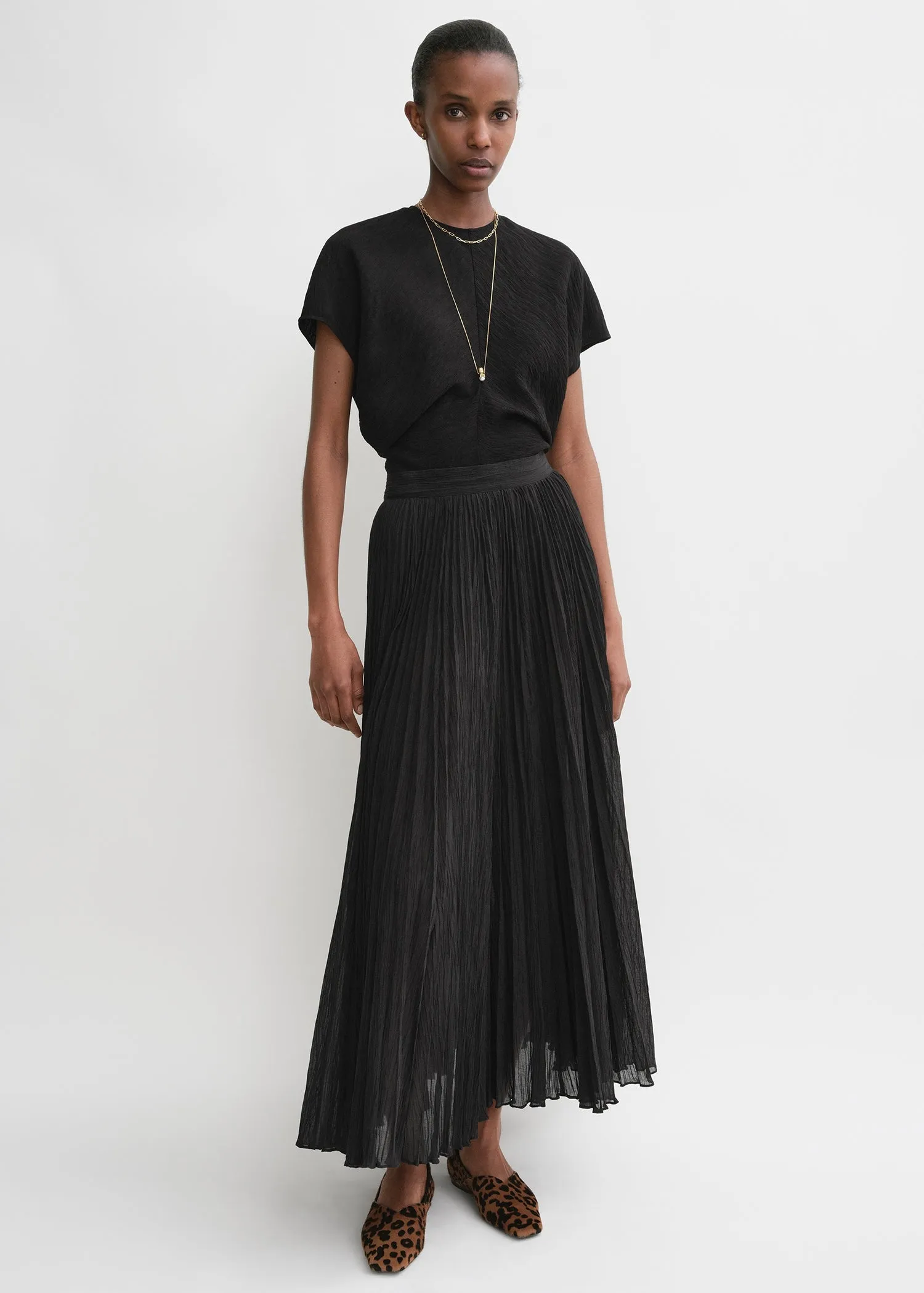 Crinkled plissé skirt black sold by Toteme