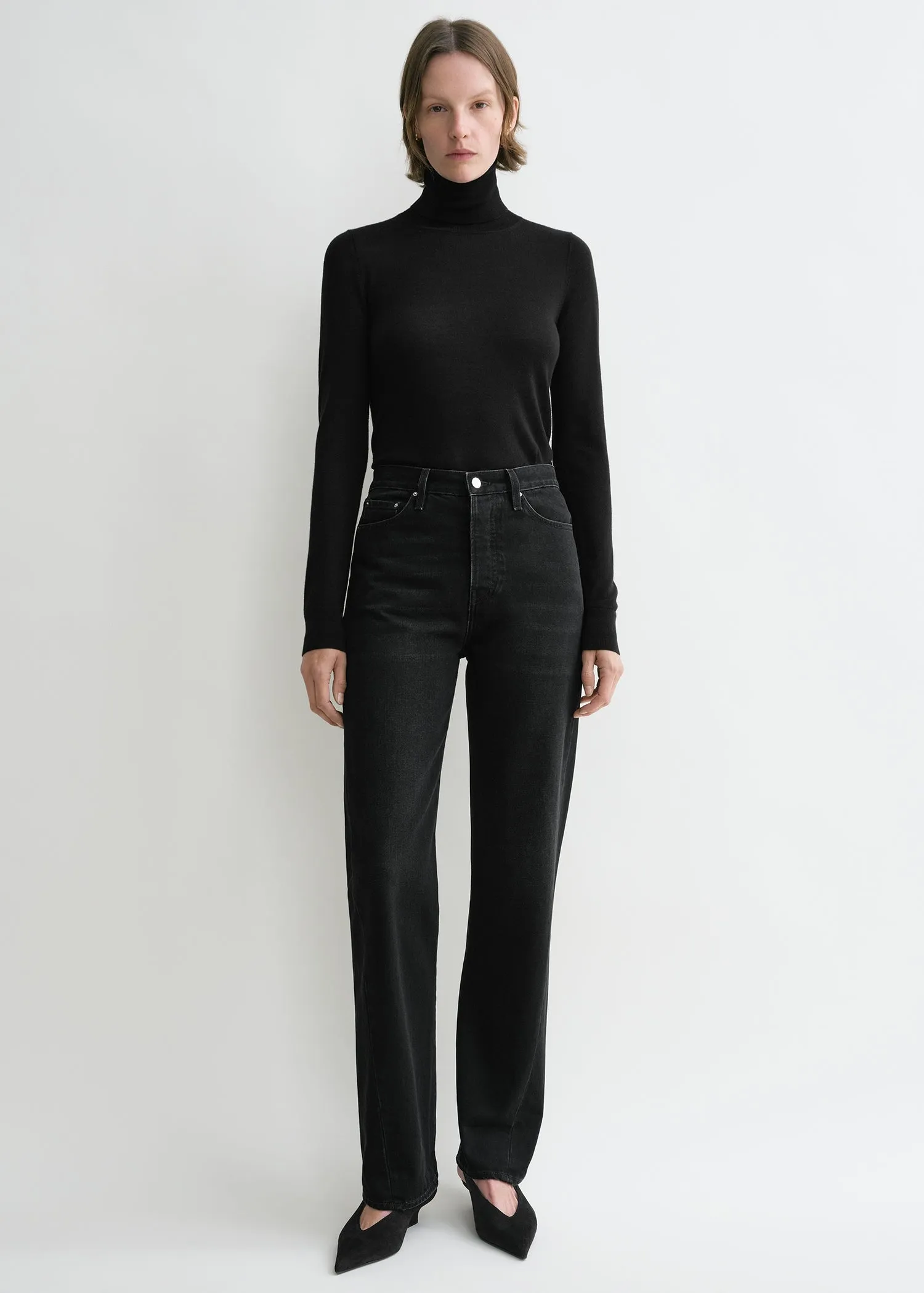 Twisted seam denim full length faded black sold by Toteme