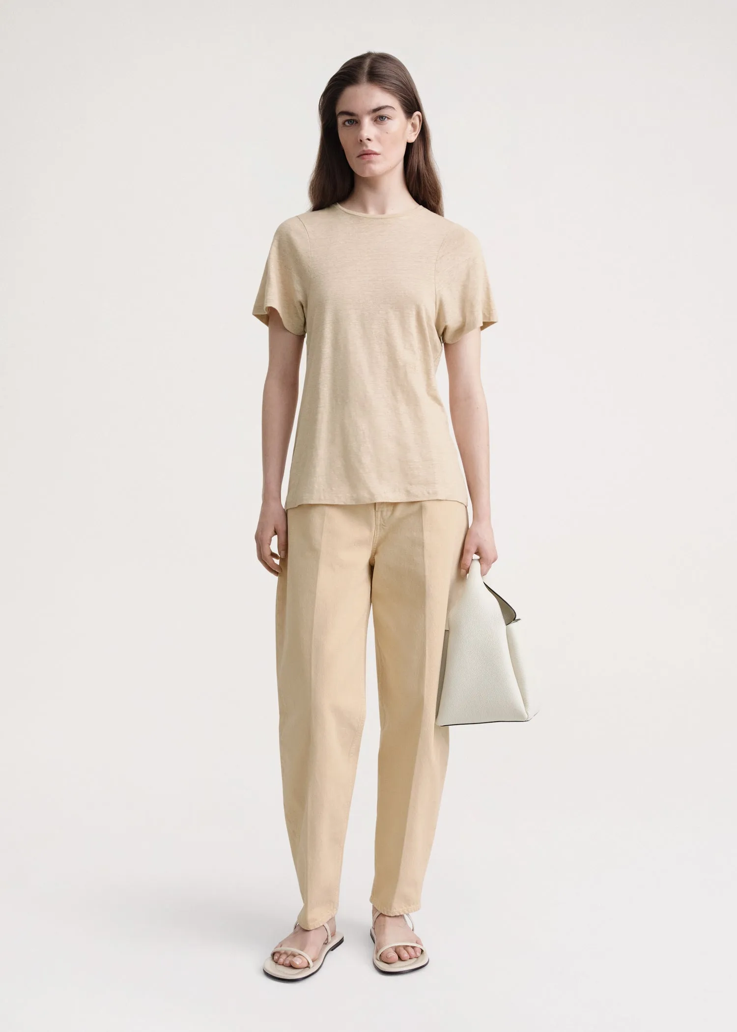 Curved seam linen tee sand sold by Toteme
