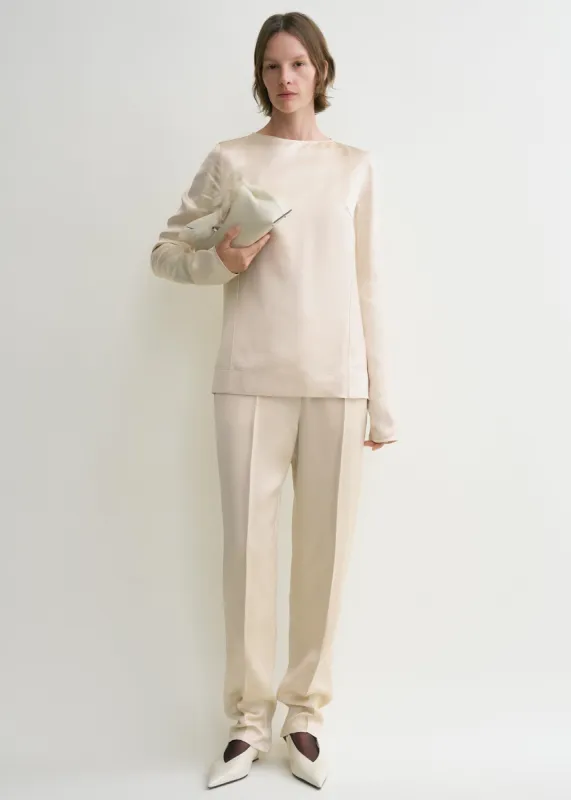 Long-sleeve satin top ecru sold by Toteme