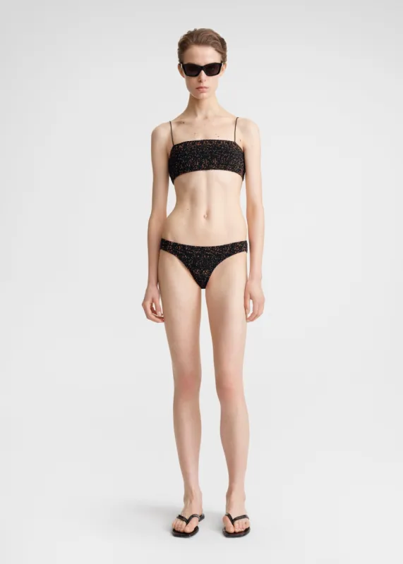 Smocked mini bikini bottoms tortoise sold by Toteme