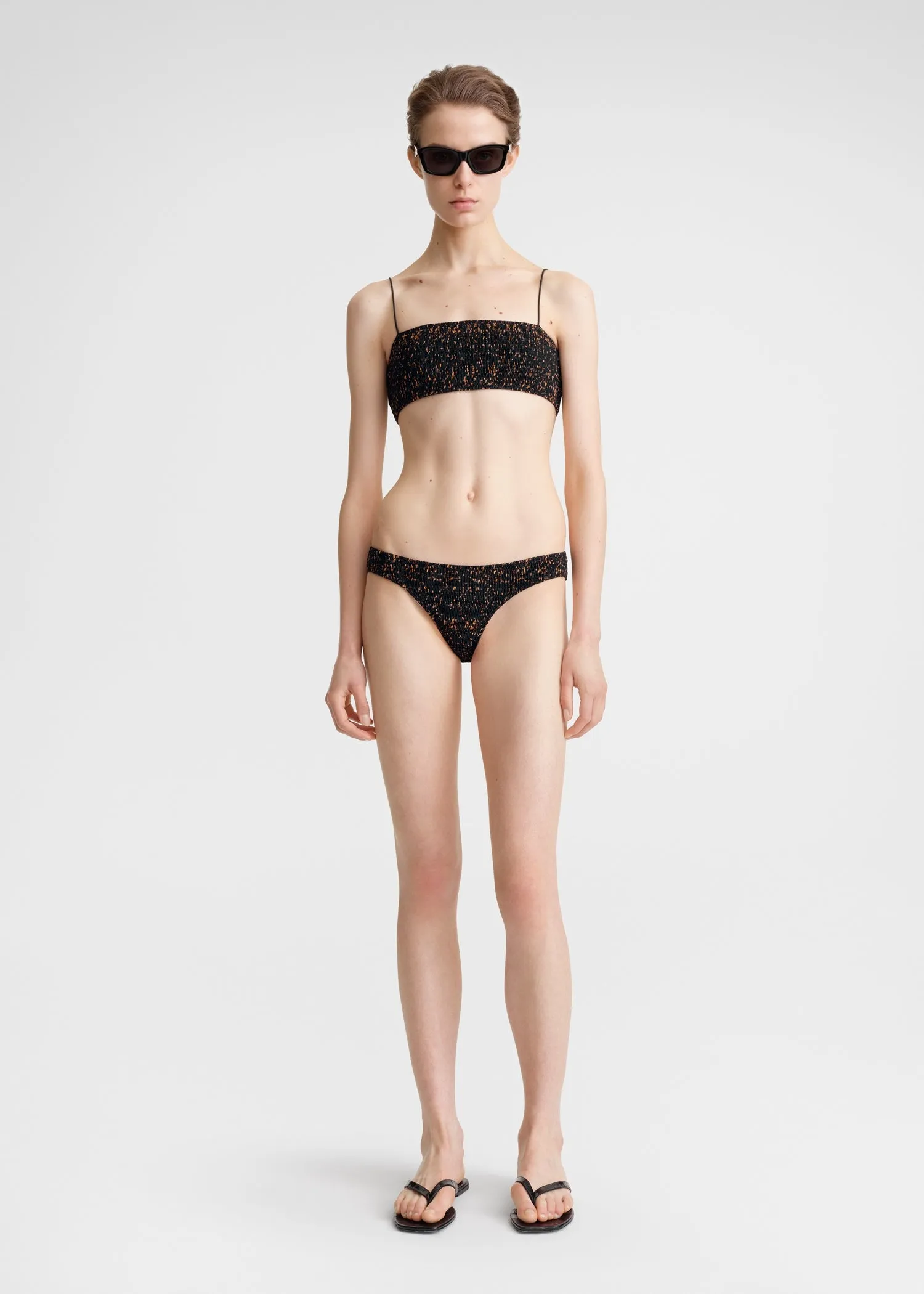 Smocked mini bikini bottoms tortoise sold by Toteme
