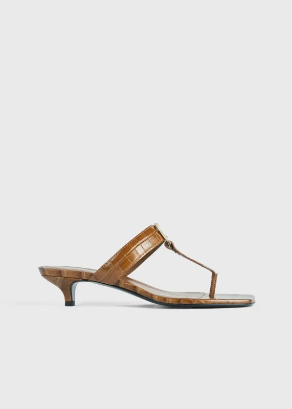 The Belted Croco Flip-Flop Heel camel sold by Toteme
