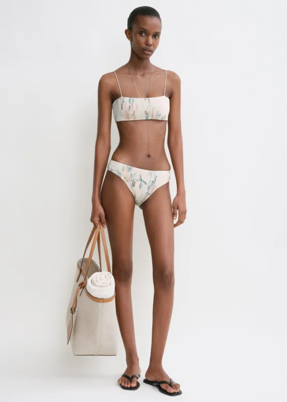 Smocked bikini top washed floral sold by Toteme