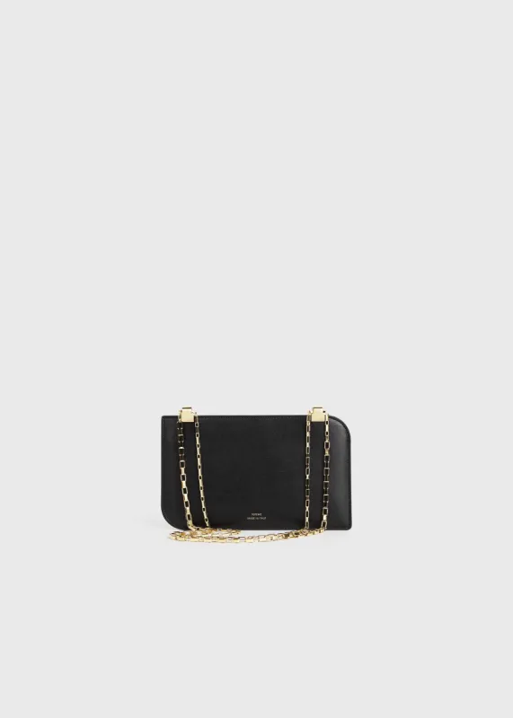 Chain pouch black sold by Toteme