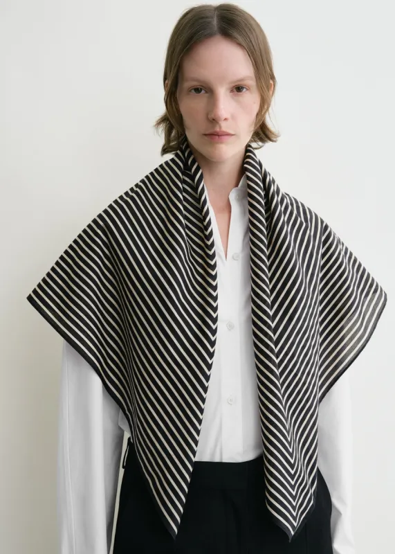 Signature monogram cotton blanket scarf black sold by Toteme