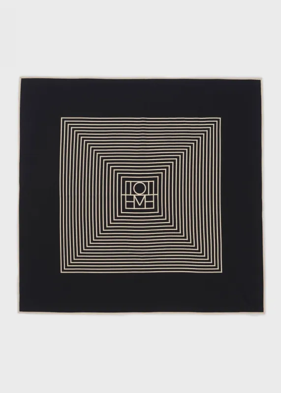 Centered monogram silk scarf black sold by Toteme