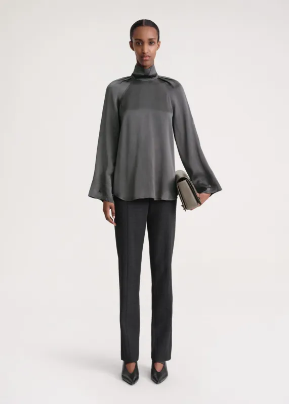 High-neck crepe blouse lead sold by Toteme