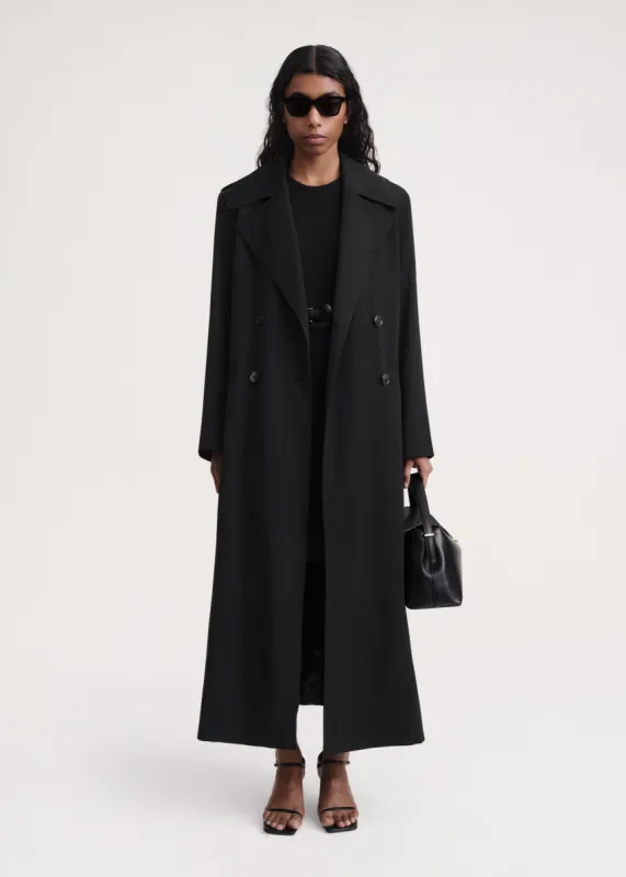 Long fluid summer coat black sold by Toteme