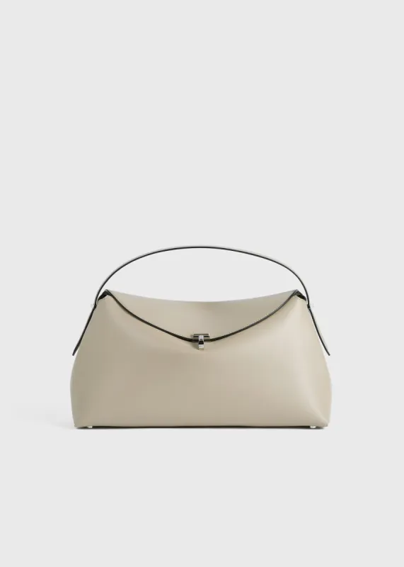 T-Lock leather top handle fawn sold by Toteme