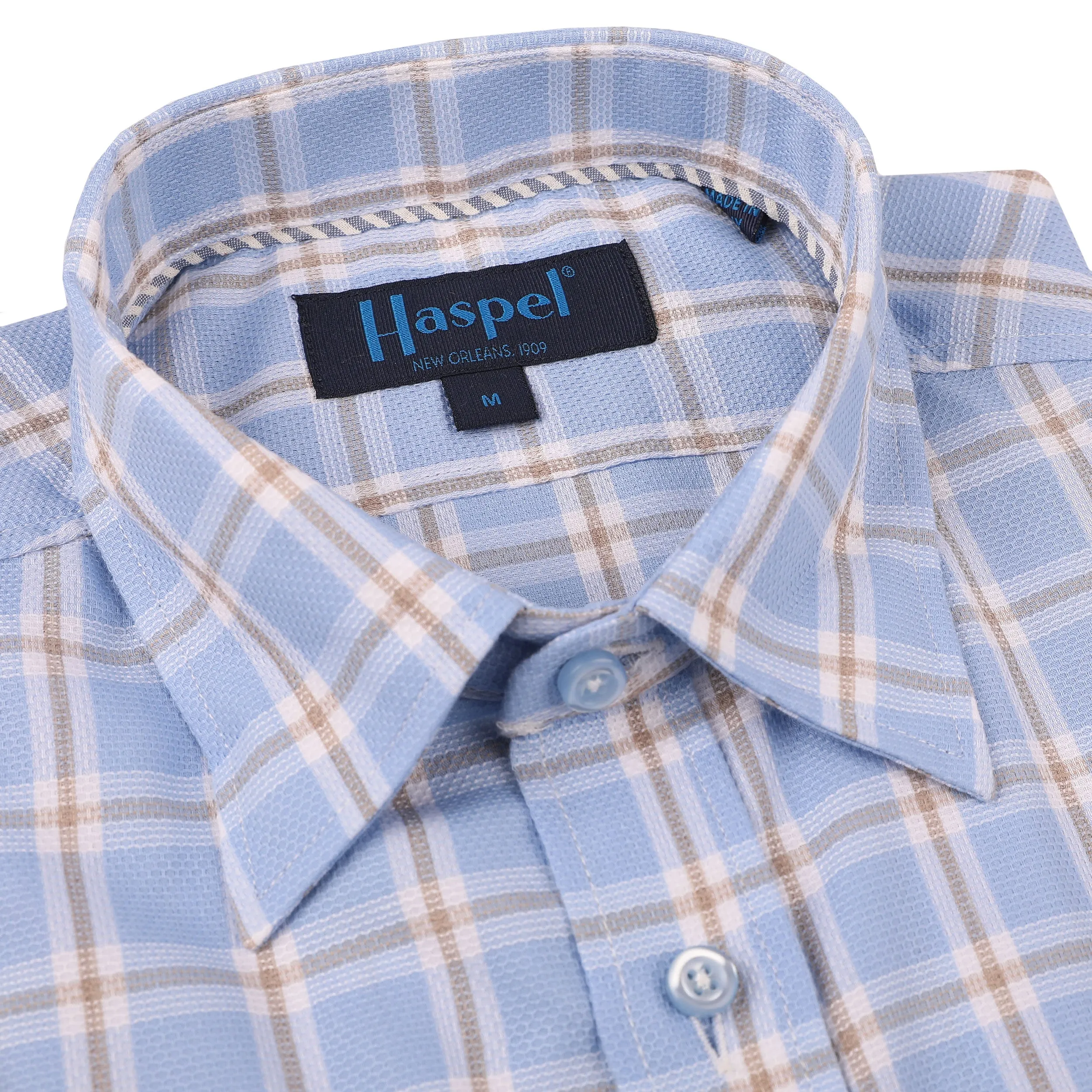 Treme Light Blue Texture with Tan Check sold by Haspel