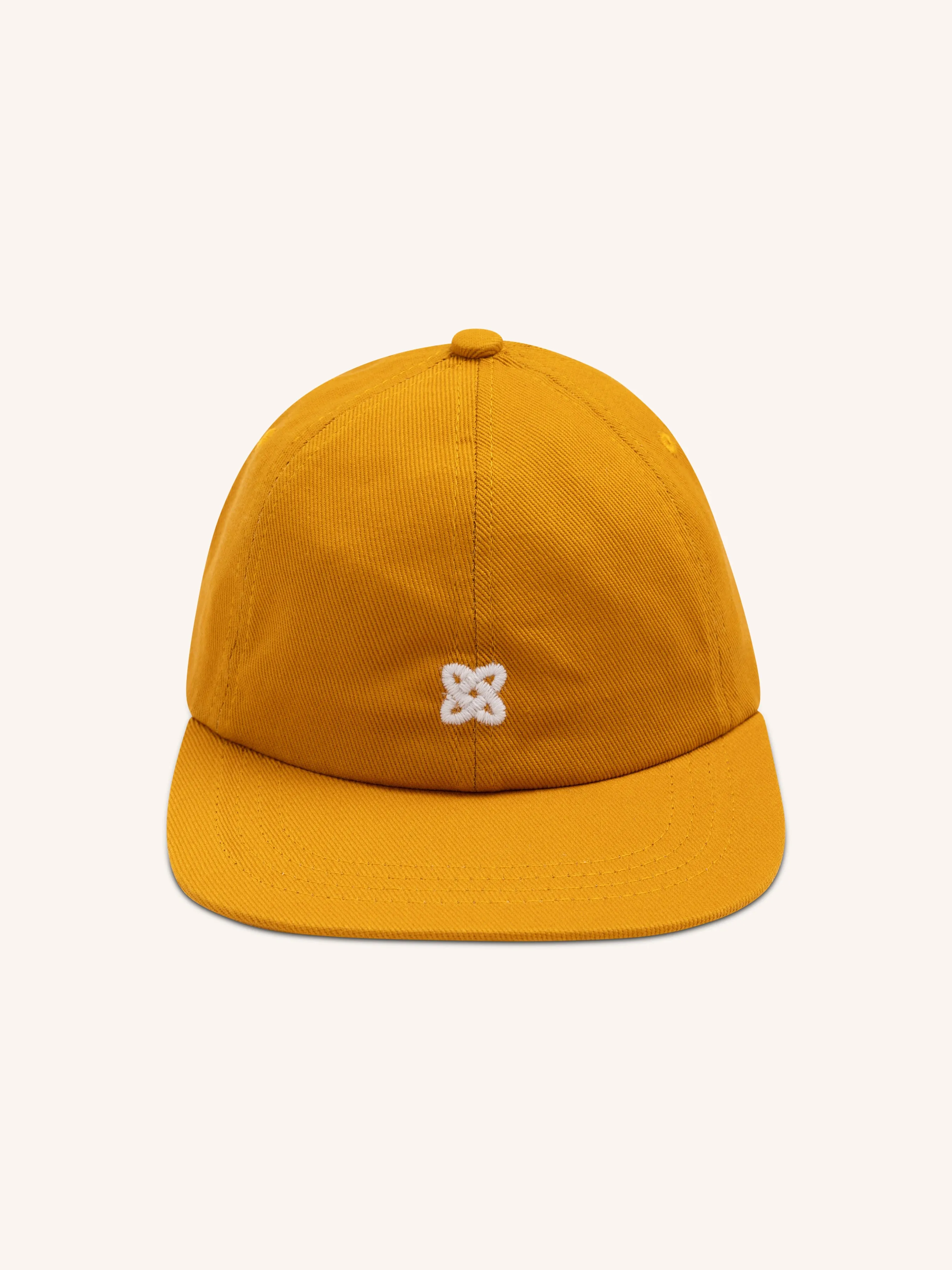 Leuchars Cap in Embroidered Yellow Ochre Twill sold by Kestin