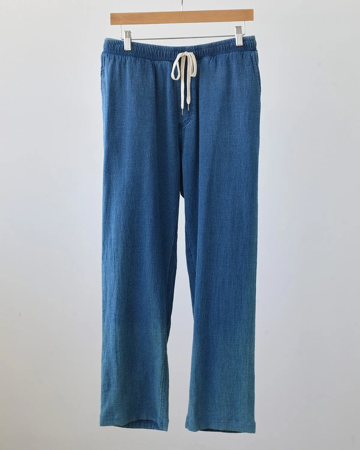 Washed Indigo Drawstring Trousers sold by Corridor