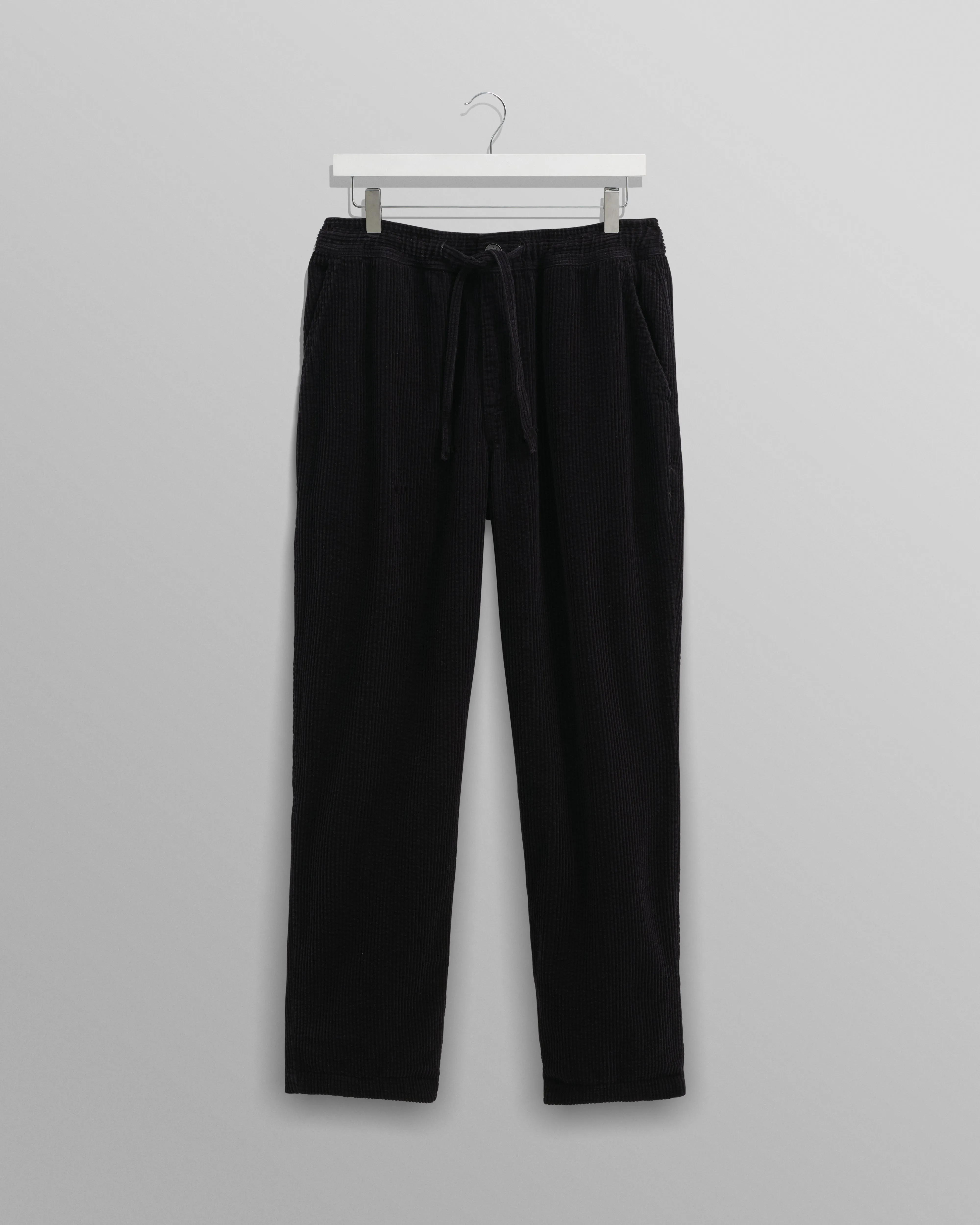 Kyle - Navy Jumbo Corduroy Trousers sold by Wax London