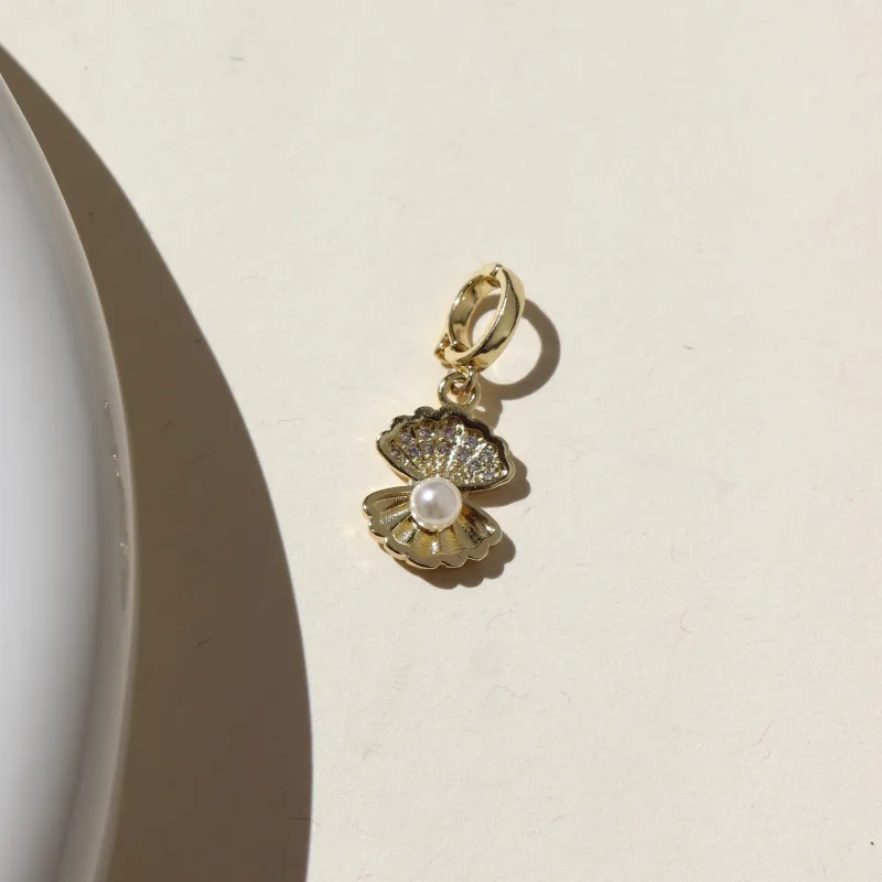 Sea Shell with Pearl Charm sold by Token Jewelry