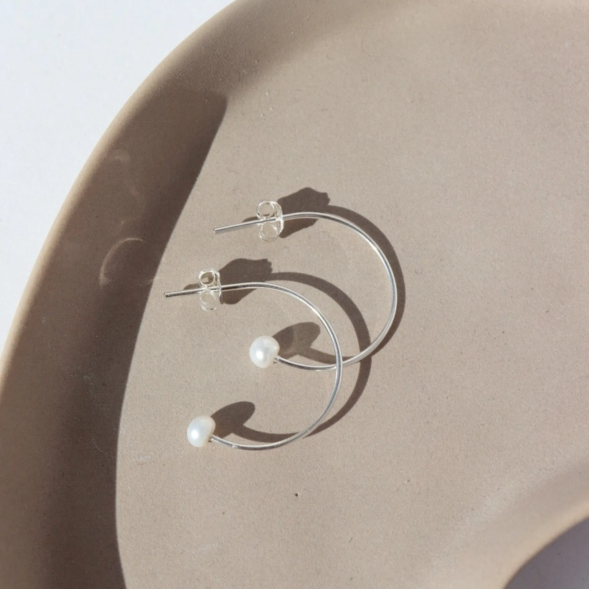 Balanced Pearl Hoops sold by Token Jewelry product image thumbnail 3