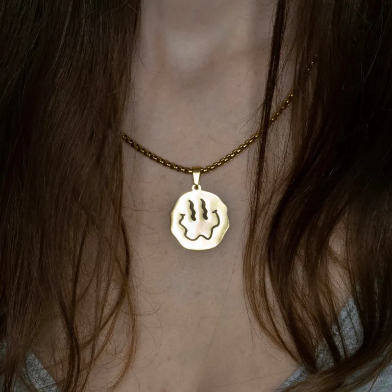 Trippy Smiley Necklace sold by Regina jewelry