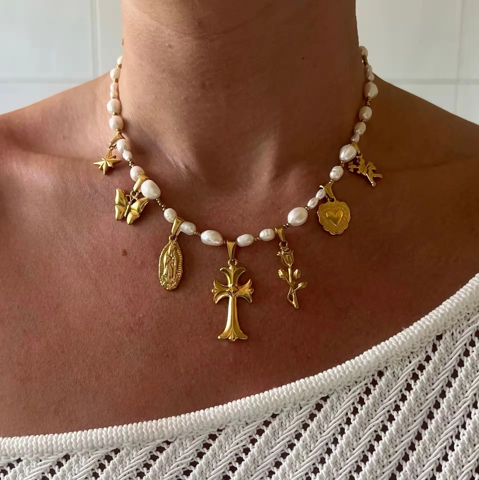 Pearls And Charms Necklace sold by Regina jewelry