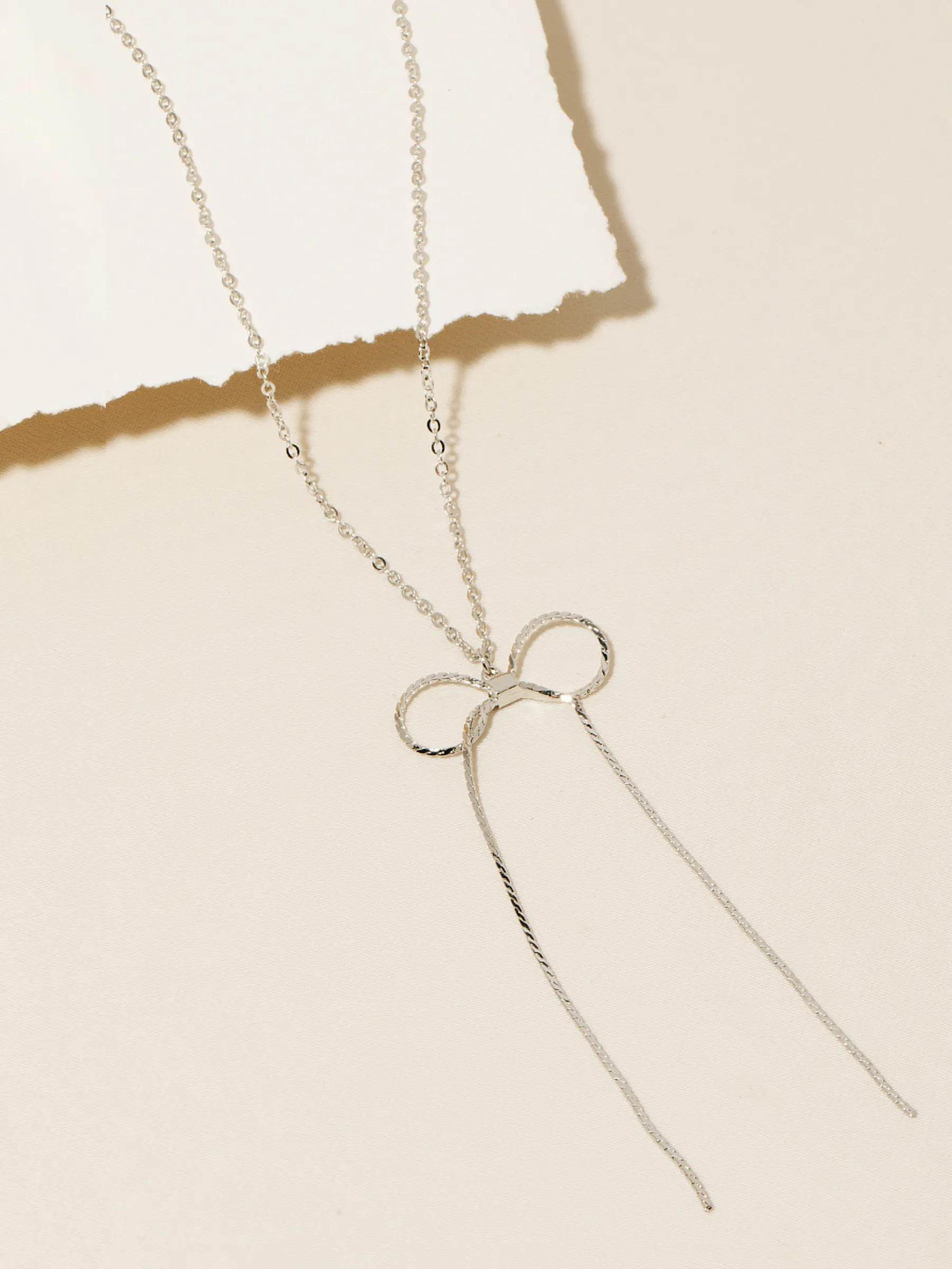 Chain Ribbon Bow Necklace sold by Plenty product image thumbnail 2