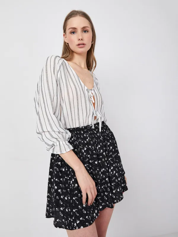 Print Serena Smocked Mini Skirt sold by Plenty