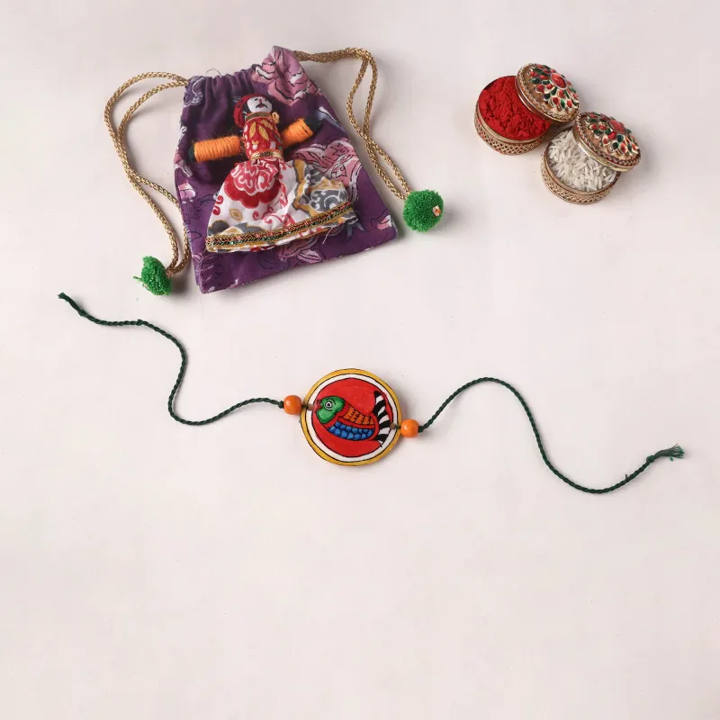 Handpainted Tholu Bommalata Leather Rakhi (Assorted) 10 made by Itokri