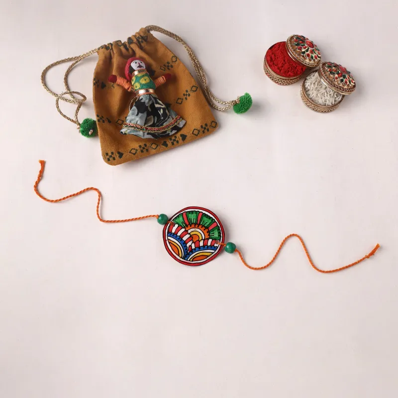 Handpainted Tholu Bommalata Leather Rakhi (Assorted) 08 made by Itokri