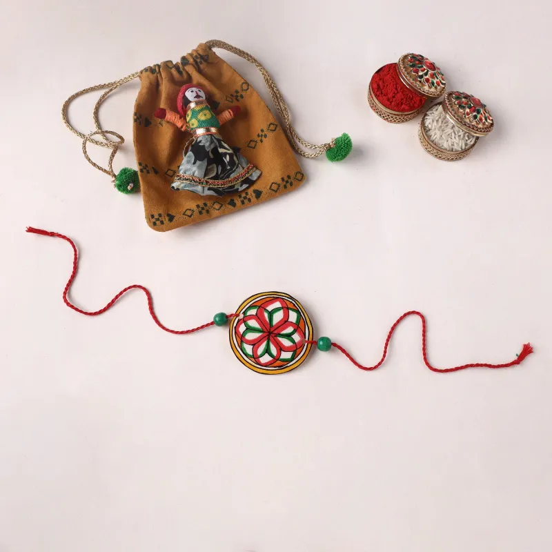 Handpainted Tholu Bommalata Leather Rakhi (Assorted) 04 made by Itokri