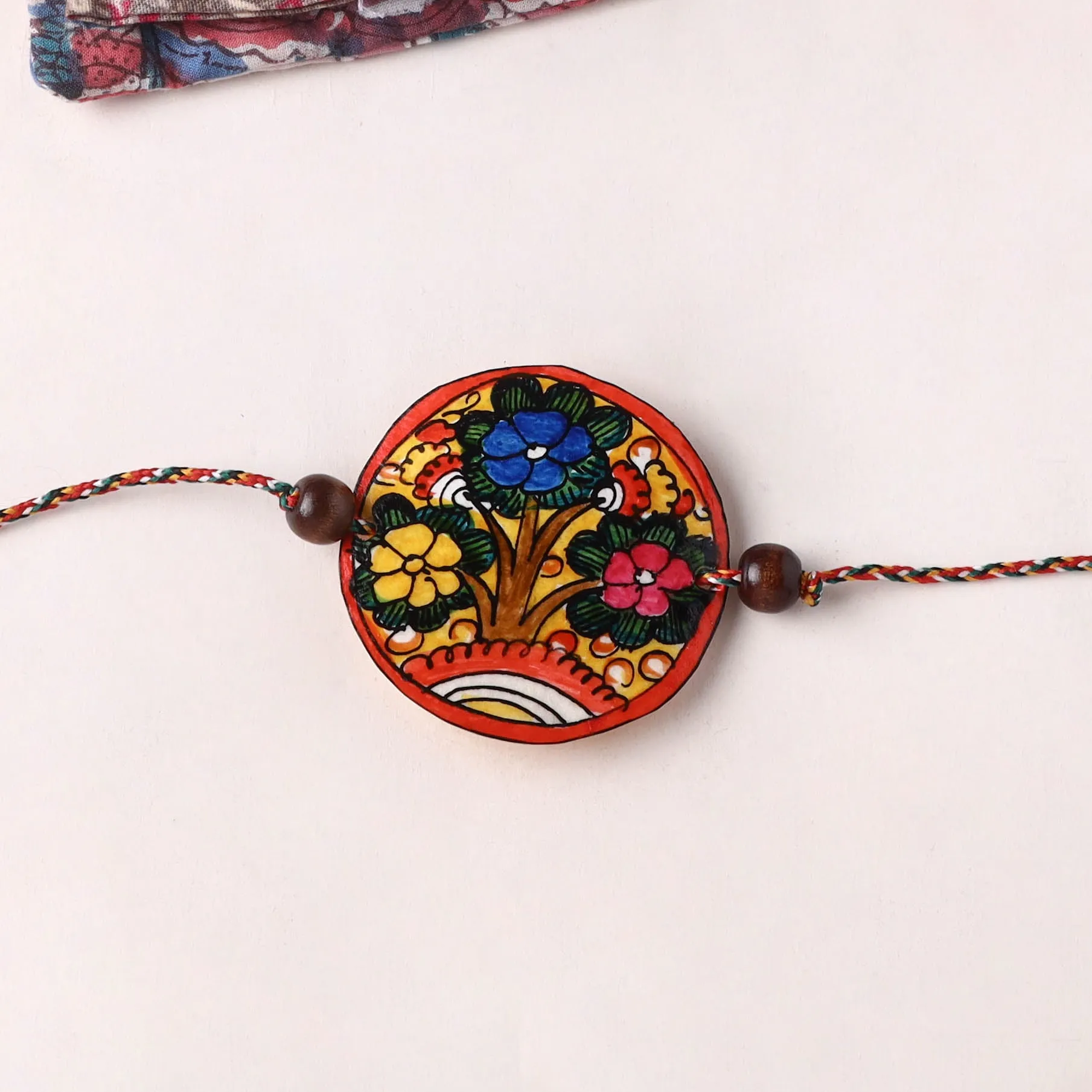 Flower - Handpainted Tholu Bommalata Leather Rakhi (Assorted) 30 sold by Itokri product image thumbnail 2