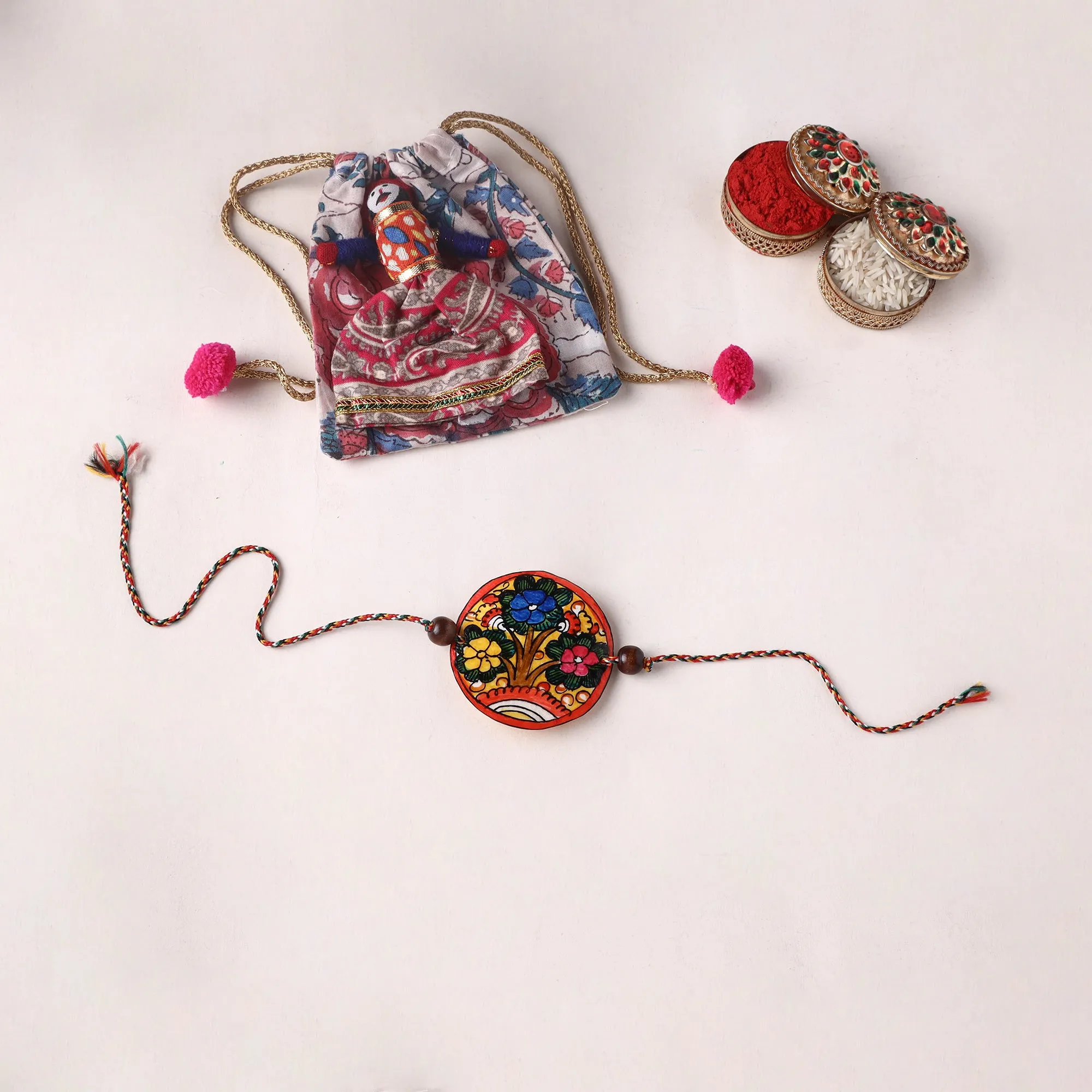 Flower - Handpainted Tholu Bommalata Leather Rakhi (Assorted) 30 sold by Itokri