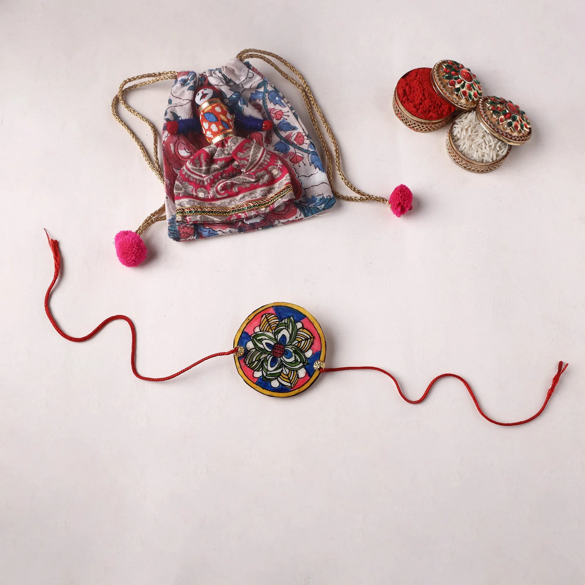 Flower - Handpainted Tholu Bommalata Leather Rakhi (Assorted) 29 sold by Itokri
