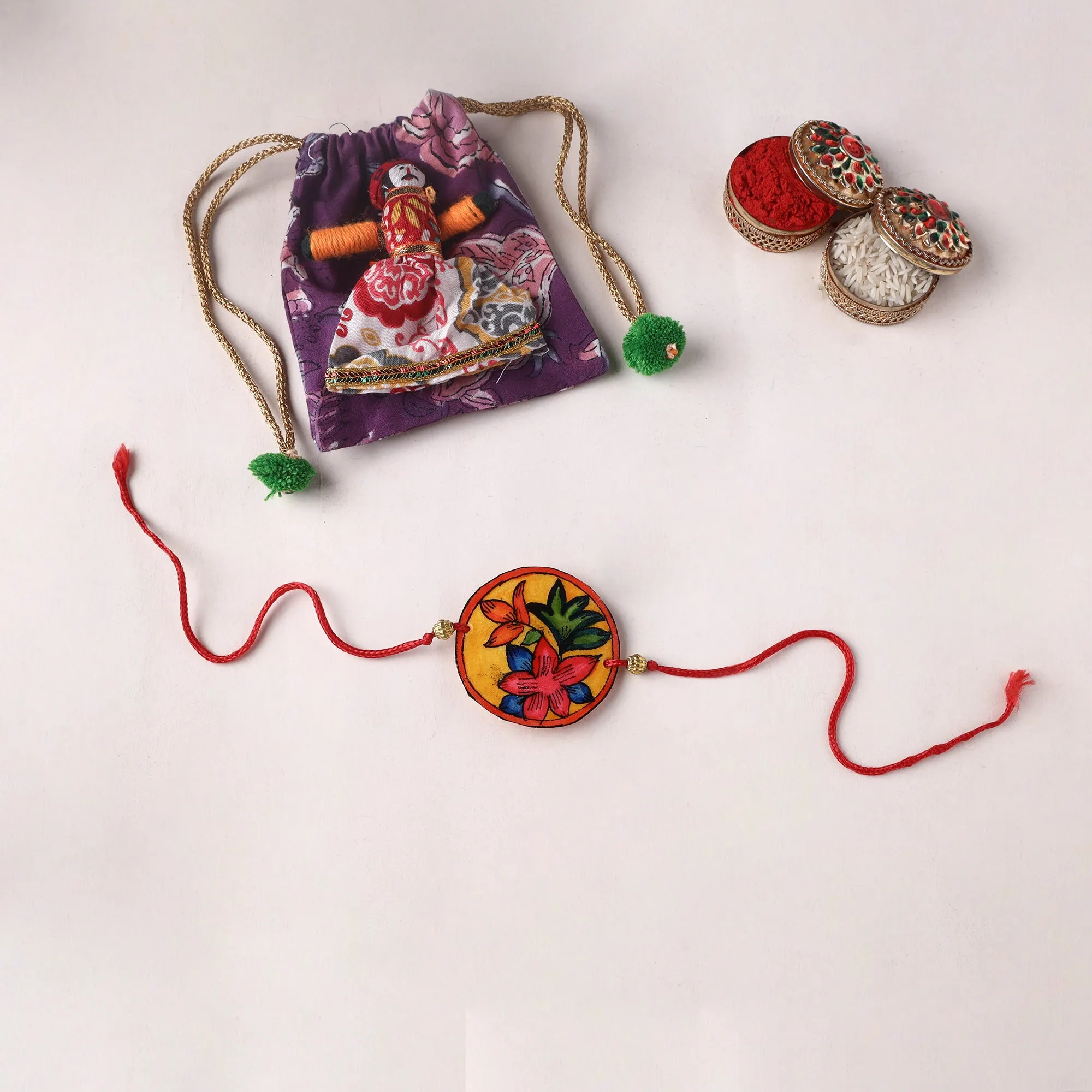 Flower - Handpainted Tholu Bommalata Leather Rakhi (Assorted) 28 sold by Itokri
