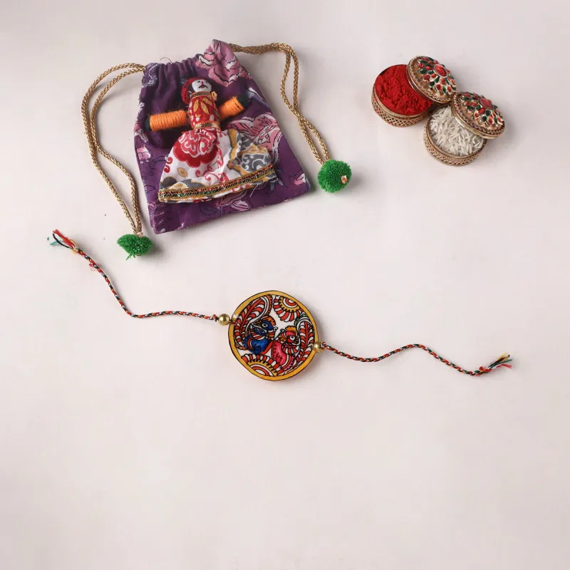 Peacocks - Handpainted Tholu Bommalata Leather Rakhi (Assorted) 27 made by Itokri