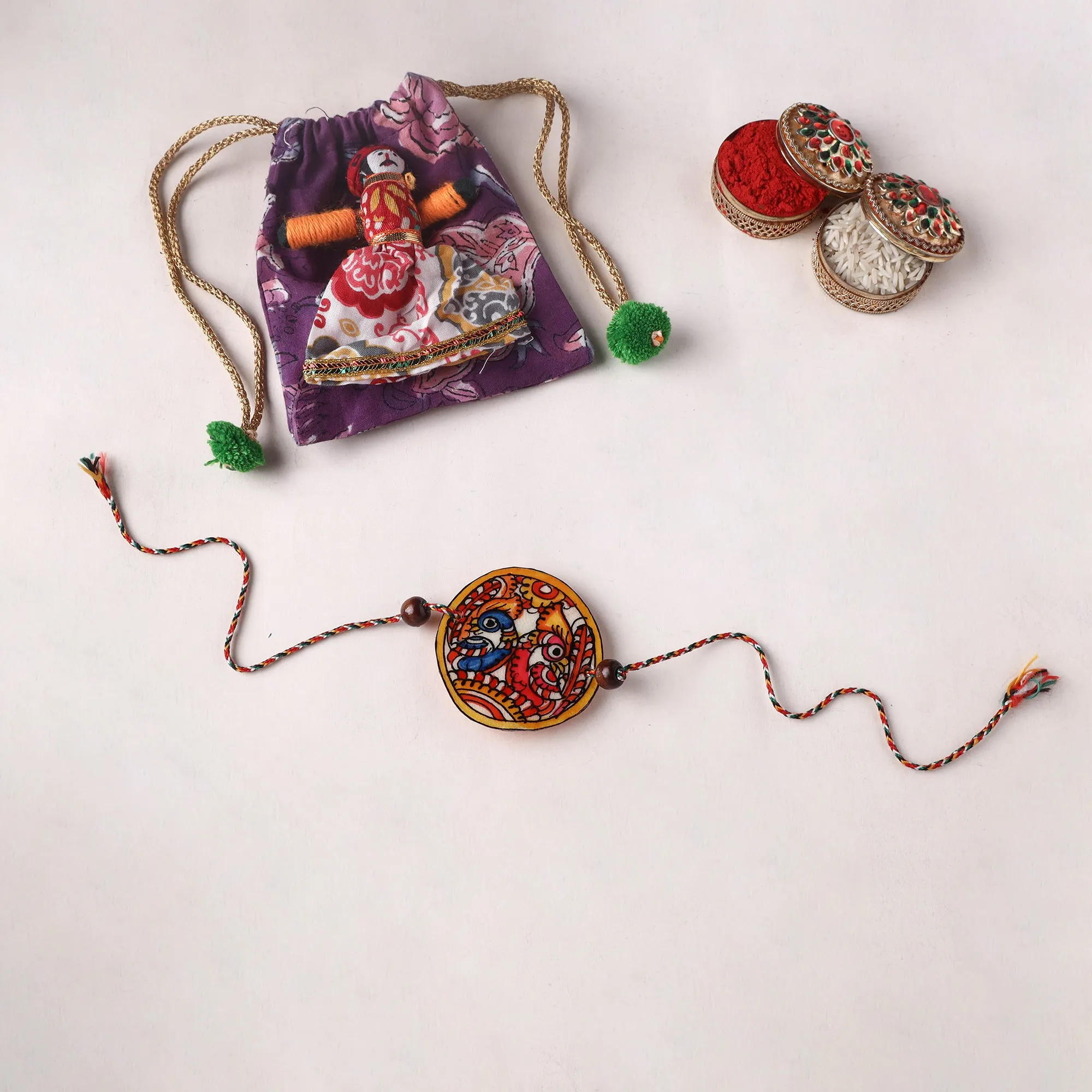 Handpainted Tholu Bommalata Leather Rakhi (Assorted) 22 sold by Itokri