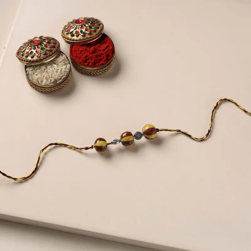 Multicolor - Handmade Blue Pottery & GS Bead Work Rakhi with Potli 17 made by Itokri