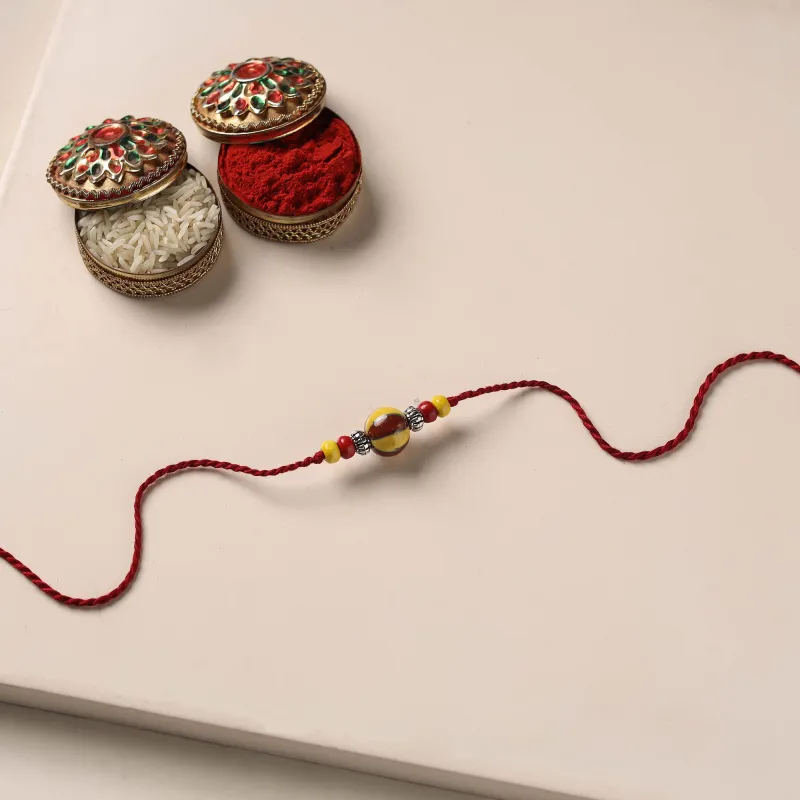 Multicolor - Handmade Blue Pottery & GS Bead Work Rakhi with Potli 08 made by Itokri