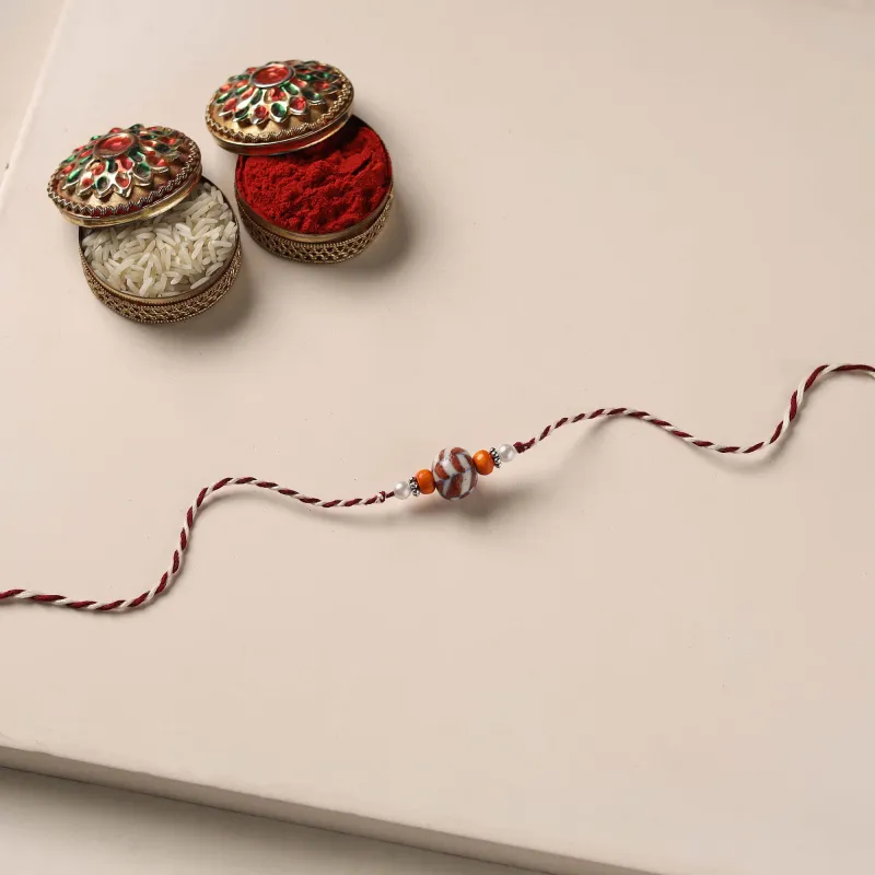 Multicolor - Handmade Blue Pottery & GS Bead Work Rakhi with Potli 06 made by Itokri