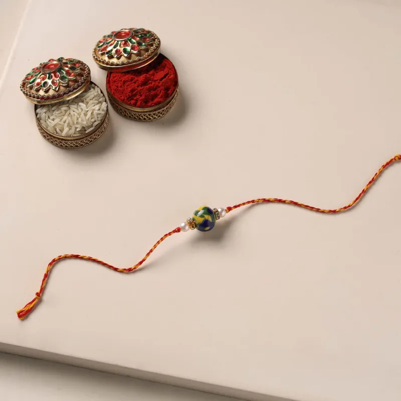 Multicolor - Handmade Blue Pottery & GS Bead Work Rakhi with Potli 05 made by Itokri