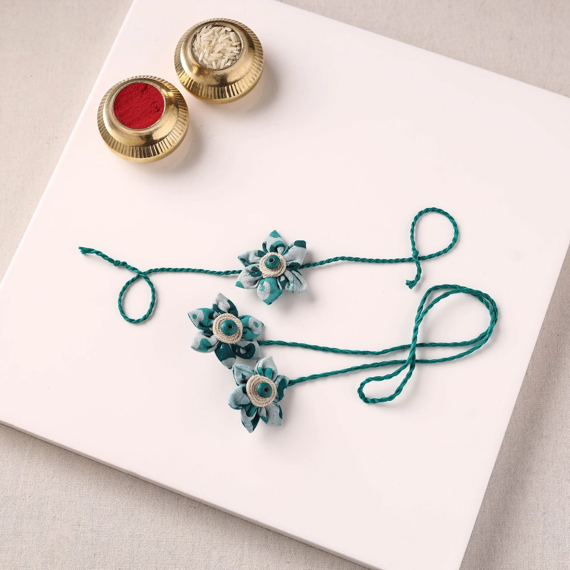 Flower Handmade Thread Work Fabart Rakhi & Lumba Set with Potli 128 sold by Itokri