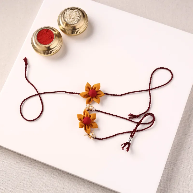 Flower Handmade Fabart Bhaiya Bhabhi Rakhi Set with Potli 115 made by Itokri