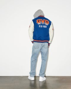 NBA NEW YORK KNICKS VARSITY JACKET - BLUE sold by OVO