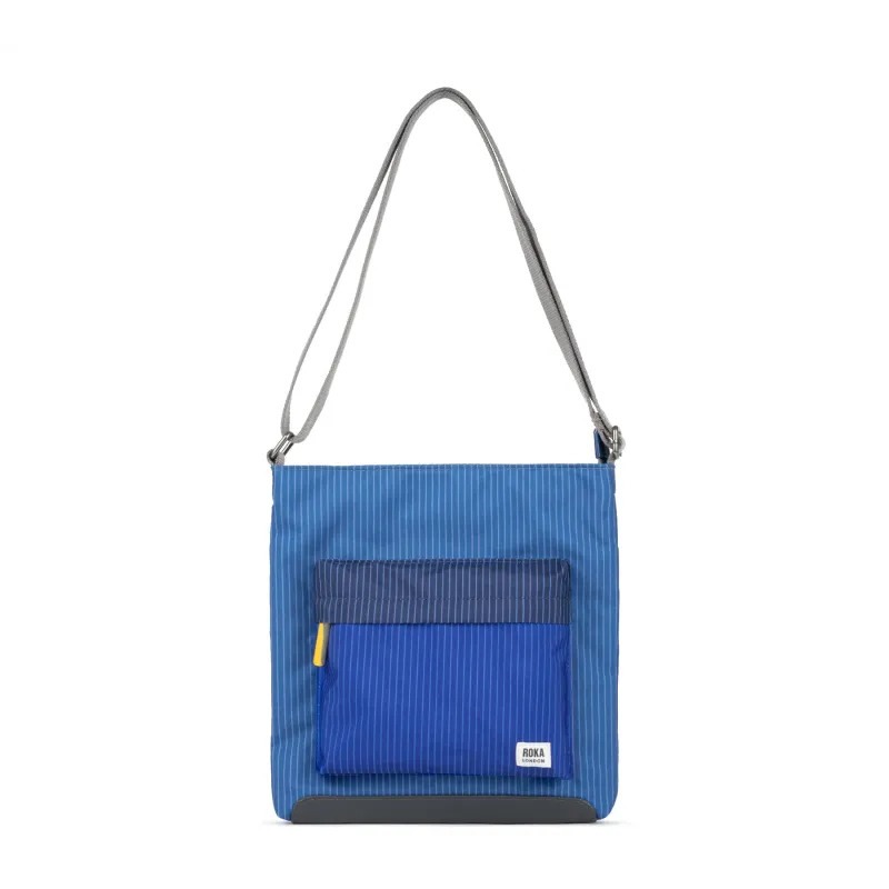 ROKA Creative Waste Kennington B Denim Wash Medium Recycled Canvas Bag sold by The Foot Factory