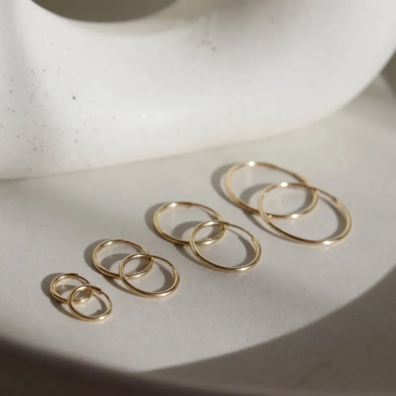 Token Jewelry | Goldie Hoops - 14k Gold Fill / 16mm sold by Fort
