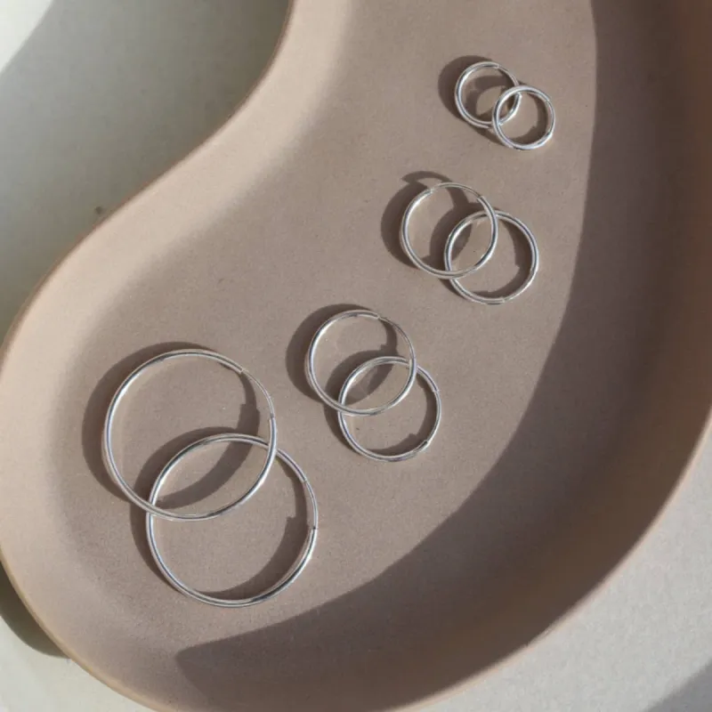 Token Jewelry | Goldie Hoops - Sterling Silver / 24mm sold by Fort